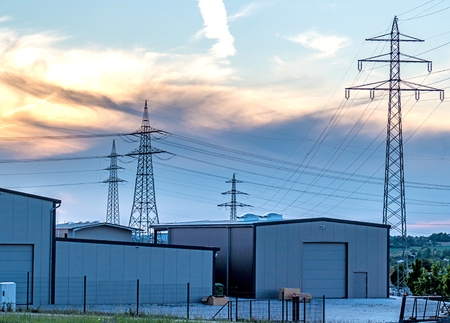 High voltage masts at sunset